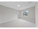 Simple bedroom with carpet and a window overlooking the backyard at 2518 Silas Peak Ln, Apex, NC 27523