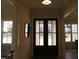 Bright entryway with double doors and hardwood floors at 2518 Silas Peak Ln, Apex, NC 27523