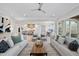 Open living room with hardwood floors and a view of the kitchen at 2518 Silas Peak Ln, Apex, NC 27523