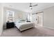 Bright bedroom with carpeted floor, large windows, and sliding barn door at 106 Wichita Way, Louisburg, NC 27549