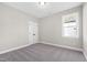 Simple bedroom with carpeted floor and double doors at 106 Wichita Way, Louisburg, NC 27549