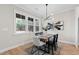 Dining room with wood table, neutral decor and hardwood floors at 106 Wichita Way, Louisburg, NC 27549