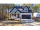 Craftsman style home with two-toned exterior and a two car garage at 106 Wichita Way, Louisburg, NC 27549