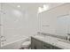 Bathroom featuring tile floors, grey cabinets, and a bathtub at 148 Harmony Trl, Broadway, NC 27505
