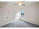 A bedroom featuring a window, ceiling fan, neutral walls and carpeted floor at 148 Harmony Trl, Broadway, NC 27505
