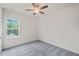 A bedroom featuring a window, ceiling fan, neutral walls and carpeted floor at 148 Harmony Trl, Broadway, NC 27505