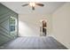 Bedroom featuring carpet, green accent wall and an open doorway to the en-suite bathroom at 148 Harmony Trl, Broadway, NC 27505