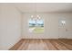 Spacious dining room with hardwood floors and chandelier at 148 Harmony Trl, Broadway, NC 27505