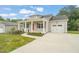 Inviting front exterior with a bright red door and ample parking space at 148 Harmony Trl, Broadway, NC 27505