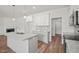 Beautiful kitchen with granite countertops, an island with a sink, and modern stainless steel appliances at 148 Harmony Trl, Broadway, NC 27505