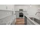 Modern kitchen featuring gray cabinets, granite countertops, stainless steel appliances, and hardwood flooring at 148 Harmony Trl, Broadway, NC 27505