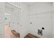Laundry room featuring tile floors, overhead storage, and modern appliances at 148 Harmony Trl, Broadway, NC 27505