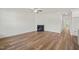Open-concept living room featuring hard wood floors and a fireplace at 148 Harmony Trl, Broadway, NC 27505