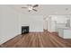 Open-concept living room featuring hard wood floors and a fireplace at 148 Harmony Trl, Broadway, NC 27505