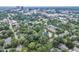 Ariel view shows houses and apartments in a cityscape surrounded by many trees at 918 N Blount St, Raleigh, NC 27604