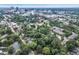 An aerial of a city featuring residential neighborhoods, commercial buildings, and green spaces at 918 N Blount St, Raleigh, NC 27604