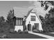 Charming white brick home boasts classic architectural details and inviting curb appeal with manicured landscaping at 918 N Blount St, Raleigh, NC 27604
