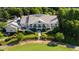 Aerial view of clubhouse and landscaping with manicured lawn, shrubs and flowers at 1820 Oatlands Court Ct, Wake Forest, NC 27587