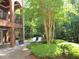 Secluded backyard featuring lounge chairs, lush landscaping, and mature trees at 1820 Oatlands Court Ct, Wake Forest, NC 27587
