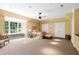 Inviting bedroom featuring a large window seat, ceiling fan, and neutral decor for a relaxing atmosphere at 1820 Oatlands Court Ct, Wake Forest, NC 27587