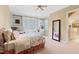 Cozy bedroom featuring a window seat, built-in shelving, and a comfortable bed with floral bedding at 1820 Oatlands Court Ct, Wake Forest, NC 27587