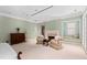 Large bedroom includes sitting area with fireplace, shutters, and built-in display cabinet at 1820 Oatlands Court Ct, Wake Forest, NC 27587
