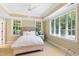 Inviting bedroom with ample natural light, ceiling fan and ensuite bathroom at 1820 Oatlands Court Ct, Wake Forest, NC 27587