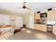 Spacious bedroom featuring a ceiling fan, double closets, and a wet bar for added convenience at 1820 Oatlands Court Ct, Wake Forest, NC 27587