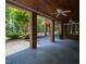 Expansive covered patio with brick columns, ceiling fans and stamped concrete flooring, perfect for outdoor entertaining at 1820 Oatlands Court Ct, Wake Forest, NC 27587