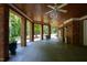 Large covered patio featuring brick columns and a wood ceiling for outdoor enjoyment at 1820 Oatlands Court Ct, Wake Forest, NC 27587