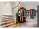Elegant foyer boasts a staircase, ticket booth, and unique design elements for a grand entrance at 1820 Oatlands Court Ct, Wake Forest, NC 27587