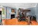 Home gym featuring a full fireplace, workout machines, and wall art at 1820 Oatlands Court Ct, Wake Forest, NC 27587