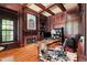 Sophisticated home office with rich wood paneling, fireplace, and custom desk at 1820 Oatlands Court Ct, Wake Forest, NC 27587