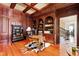 Elegant home office featuring custom cabinetry, bookshelves, and ample natural light at 1820 Oatlands Court Ct, Wake Forest, NC 27587