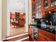Open view into kitchen with a bar area and wine refrigerator at 1820 Oatlands Court Ct, Wake Forest, NC 27587