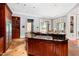 Spacious kitchen island with granite countertops, gas cooktop, and breakfast bar, perfect for meal preparation and casual dining at 1820 Oatlands Court Ct, Wake Forest, NC 27587