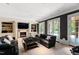 Cozy living room with a fireplace, built-in bookshelves, and access to outdoor space at 1820 Oatlands Court Ct, Wake Forest, NC 27587
