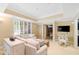 Bright, neutral living room offers recessed lighting, large window, and adjacent sitting area at 1820 Oatlands Court Ct, Wake Forest, NC 27587