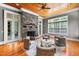 Cozy living room featuring a stone fireplace, wood ceiling, and comfortable seating at 1820 Oatlands Court Ct, Wake Forest, NC 27587