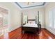 Spacious main bedroom with a four-poster bed, hardwood floors and blue ceiling trim at 1820 Oatlands Court Ct, Wake Forest, NC 27587