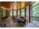 Covered porch with wooden ceiling and brick pillars showing comfortable seating at 1820 Oatlands Court Ct, Wake Forest, NC 27587