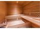 Relaxing sauna room featuring natural wood benches and paneling for a luxurious spa-like experience at home at 1820 Oatlands Court Ct, Wake Forest, NC 27587