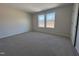 Well-lit bedroom with neutral walls and carpeted floors at 300 Tuscany Cir, Princeton, NC 27569