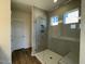 Modern bathroom with a large walk-in shower and gray tile at 500 Glenwyck Ct, Fuquay Varina, NC 27526