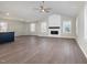 Bright living room with vaulted ceilings, a fireplace, and windows providing natural light at 104 Burnello Ct, Princeton, NC 27569