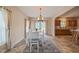 Bright dining room featuring tile floors, backyard access, and views of kitchen at 2674 Stanton Hill Rd, Cameron, NC 28326
