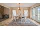 Bright dining room with a chandelier and a large window overlooking the grounds at 2674 Stanton Hill Rd, Cameron, NC 28326