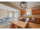 Open kitchen with island, wood cabinets, and view of the dining area at 2674 Stanton Hill Rd, Cameron, NC 28326