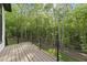 View of the wooded backyard from the deck with views of the serene forest at 7621 Falls Creek Ln, Raleigh, NC 27614