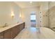 Luxurious bathroom features double vanity, freestanding tub, and modern fixtures at 7621 Falls Creek Ln, Raleigh, NC 27614